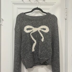 Cozy Gray Sweater with White Bow Design